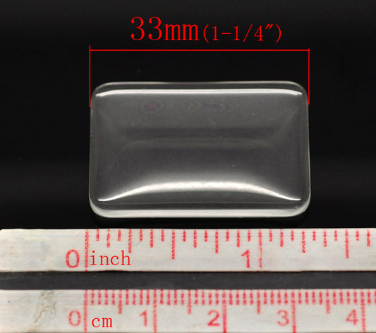 Cabochon, glass, clear, 33x23mm rectangle dome. 10pcs
