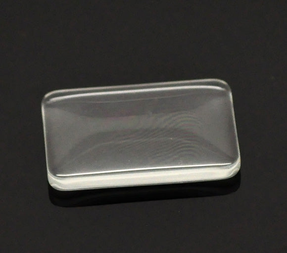 Cabochon, glass, clear, 33x23mm rectangle dome. 10pcs