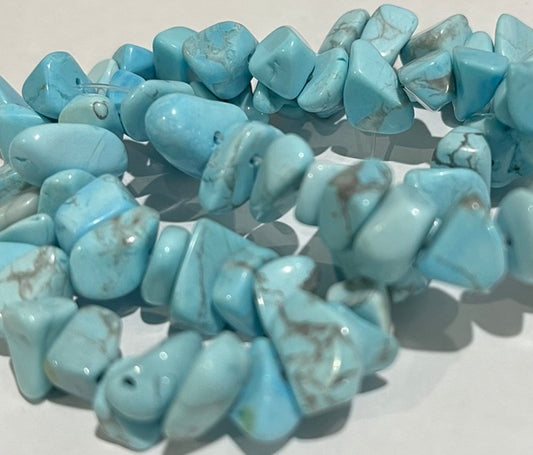 Bead, howlite (dyed), light blue, large chip,. 15-inch strand.